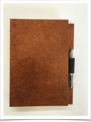 Closed Journal with Pen
